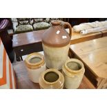 A glazed earthenware flagon and three similar jars