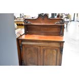 A Victorian mahogany chiffonier sideboard having shaped shelf ledge back , concealed drawer and