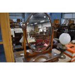 An early 20th Century mahogany toilet mirror having double drawer base