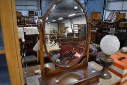 An early 20th Century mahogany toilet mirror having double drawer base