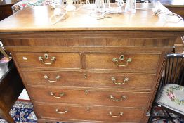 A 19th Century oak chest of two over three drawers having brass drop handles , on bracket feet,