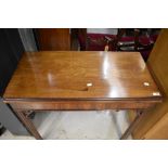 A mahogany fold over tea table in the Regency style, width approx. 85cm