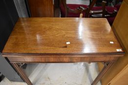 A mahogany fold over tea table in the Regency style, width approx. 85cm
