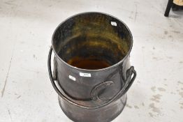 An impressive Arts and Crafts made coal bucket with hammered copper body and wrought iron copper