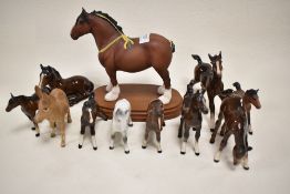 Ten Beswick figure studies of horses and foals two being damaged, also including a Royal Doulton