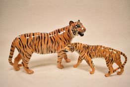 A Beswick Tiger cub 2096 and Tigress 1486