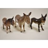 Three figure studies including Beswick Donkey 2267A, 1346B, a Goebel Donkey CE314