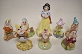 A set of Royal Doulton Snow White figure studies including Snow White SW9, Doc SW10, Grumpy SW11,