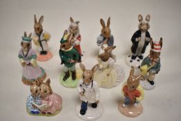 Eleven Royal Doulton Bunnykins figures including Robin Hood, Maid Marion, Judge, Lawyer, Doctor,