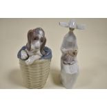 Two Lladro figure studies including Dog in Basket no. 1128 and Time to sew no. 5501 having small