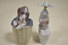 Two Lladro figure studies including Dog in Basket no. 1128 and Time to sew no. 5501 having small