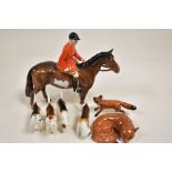 Seven Beswick figure studies including Huntsman no. 1501, four Beswick Fox Hounds, Fox no. 1440