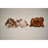 Two figure studies including Three puppies no. 917 and a Royal Doulton Spaniel and puppy DA174