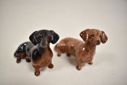 Two Beswick dog figure studies of Dachshund sausage dogs no. 1460 in tan and black glazes