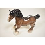 A large Beswick cantering shire horse