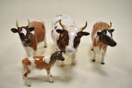 A Beswick figure study of Ayrshire Bull 1454B, two Cows 1350 and a calf 1249B