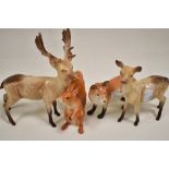 Four Beswick animal figure studies including two Fallow deer no. 981 and no. 999a also a John