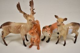Four Beswick animal figure studies including two Fallow deer no. 981 and no. 999a also a John