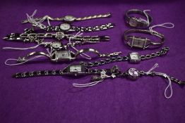 Ten ladies watches in silver tones, one having lilac face.