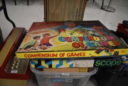 A shelf of vintage Games and Toys including Pendium of Games, Philips EE1003, Magic Robot,
