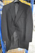 A gentleman's tailcoat by Brook Taverner approximately 44 inch chest.