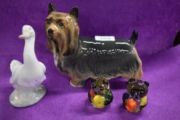 A Yorkshire terrier dog study, a Nao swan and two glass panda studies