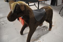 A vintage wooden and plush Horse with saddle, believed to have been retailed by Harrods, length