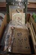 A box of ephemera including three empty vintage post card albums a selection of vintage mounted