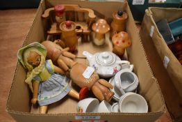 A dolls tea set and a selection of wooden toys and animals