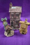 A small collection of studio pottery items, comprising a model house, dog kennel, fireplace and