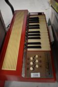 A Winfield Audition Electric Chord Organ
