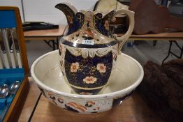 A large late 19th early 20th century wash jug and basin in the Imari palette, with gilt detailing.
