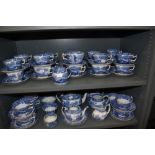 Two shelves of Copeland Spode Italian pattern tea wares including tea pot, milk jugs, sugar bowls
