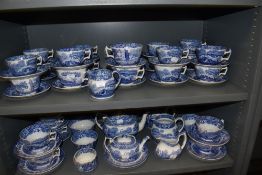 Two shelves of Copeland Spode Italian pattern tea wares including tea pot, milk jugs, sugar bowls