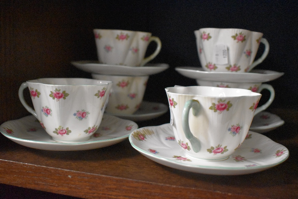 A group of six Shelley 'Rosebud' pattern tea cups and saucers