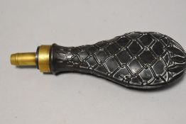 A 19th century powder or shot flask having an impressed copper body with brass fitment marked