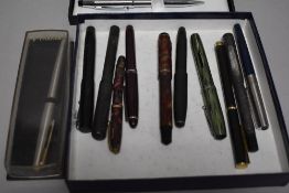 A Conway Stewart 15 fountain pen, in green and sold along with a selection of other pens including