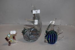 Three studio art glass tropical fish ornaments one signed Laguna to base