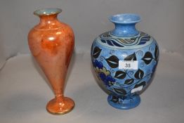 An Art Deco Chameleon Ware vase 50/113 M in good condition along with a Carlton ware orange lustre