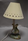 A mid century Denby Bourne table lamp possibly signed by David Yorath, with a Pixie sat on