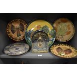 Six large studio pottery display plates having hand decorated scenes including mermaid and angels