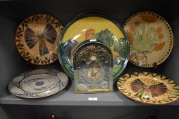 Six large studio pottery display plates having hand decorated scenes including mermaid and angels