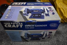 A boxed Power Craft PSM-200V bench grinder