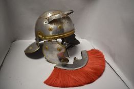A modern reproduction Roman Centurion helmet with red hair plume.