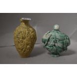 Two Chinese snuff bottles including stone carved and ceramic with 1000 faces design