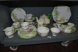 A part Royal Albert 'Greenwood Tree' pattern tea set, to include two teapots, plates, bowls, sugar