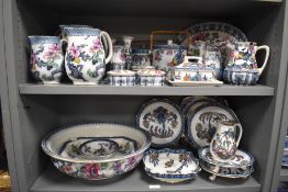 Two shelves of Losol Ware including biscuit barrels, wash bowl, graduated water jugs and dishes etc