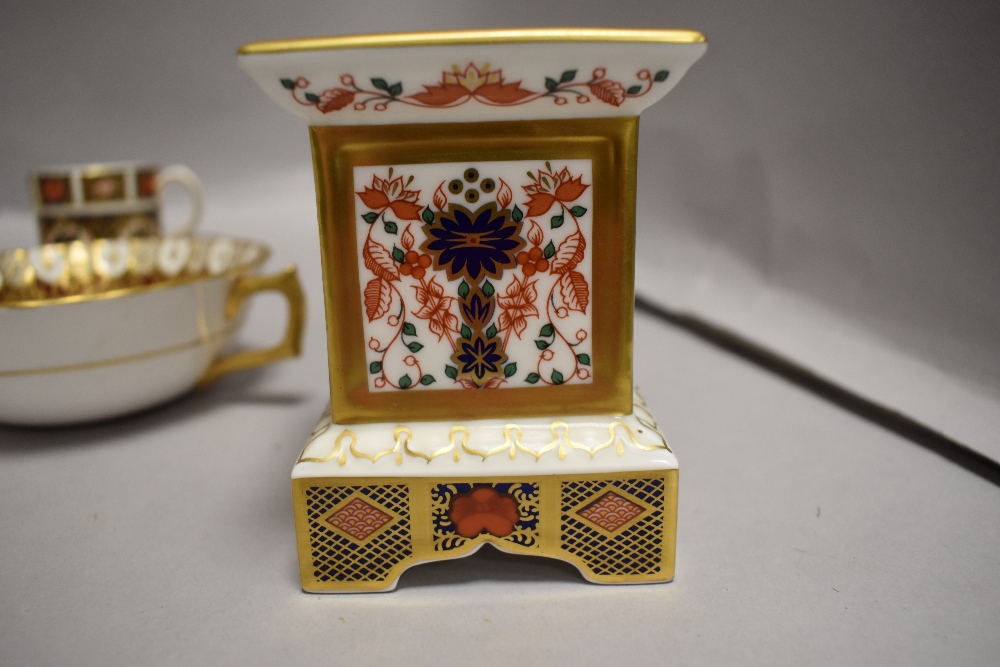 A Royal Crown Derby 1128 pattern socle form candlestick, two matching coffee cans and Imari - Image 3 of 5