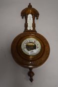 An early 20th century barometer, with opaque glass thermometer scale
