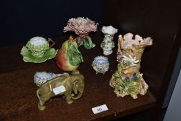 A small selection of cabinet ceramics including a Royal Dux elephant, floral spill vase, pear form